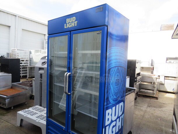 One Fogel 2 Door Bud Light Glass Door Merchandising Refrigerator With 8 Racks On Casters. Model# FROSTER-30-PVPH-US. 115 Volt. 43X26X84