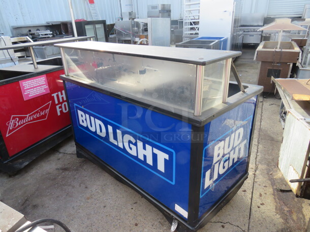 One Bud Light Ice Down Merchandiser With Over Shelf, Under Shelf, Drain On Casters. 62X30X48