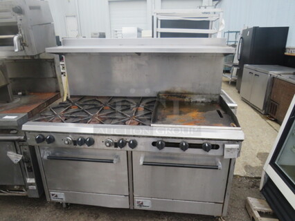 One Southbend Natural Gas 6 Burner/24 Inch Griddle Range With SS Over Shelf On Casters. 60X35X58