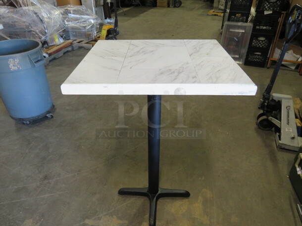 One White/Gray Tile Top Look  Table Top On A Bar Height Pedestal Base. 