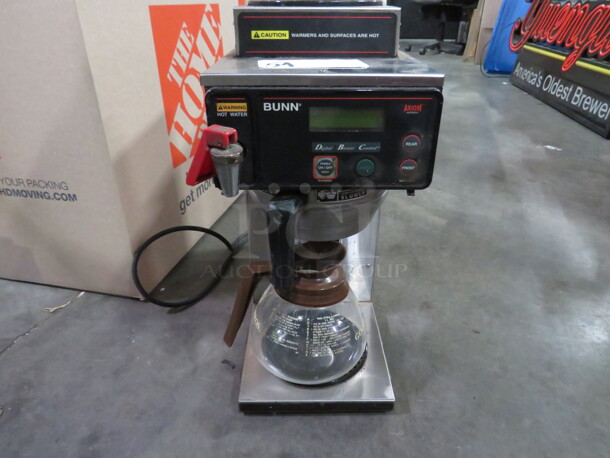 One Bunn Coffee Brewer With 2 Warmers, Filter Basket, And Pot. 120 Volt. 1800 Watt. Model# Axiom-15.