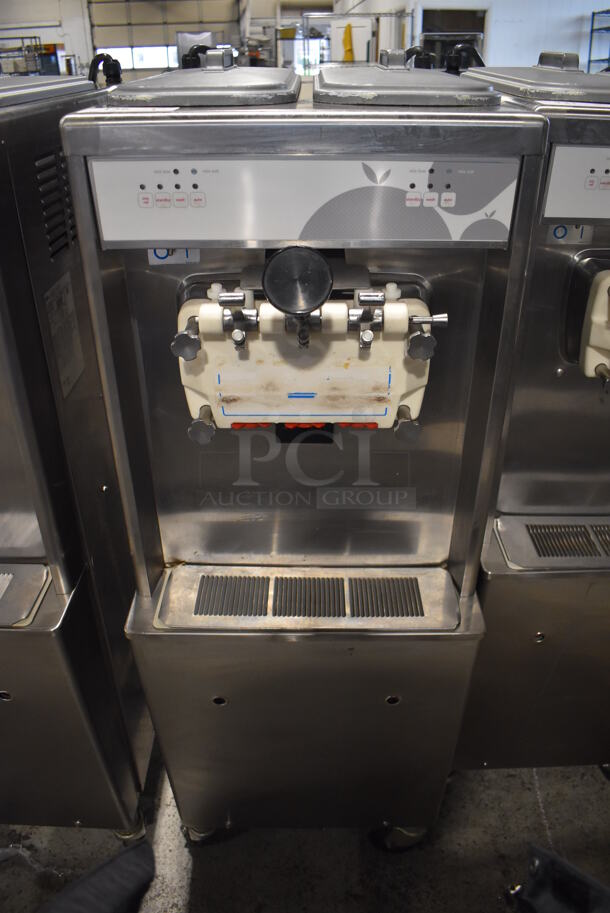 2012 Taylor 794-33 Stainless Steel Commercial Floor Style Air Cooled 2 Flavor w/ Twist Soft Serve Ice Cream Machine on Commercial Casters. 208-230 Volts, 3 Phase. 20x34x60 - Image 1 of 7