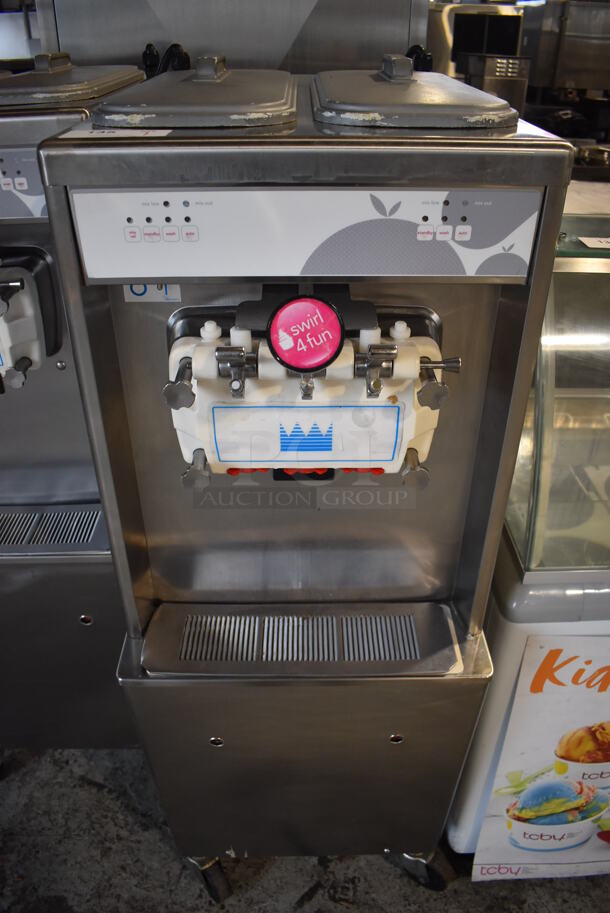 2012 Taylor 794-33 Stainless Steel Commercial Floor Style Air Cooled 2 Flavor w/ Twist Soft Serve Ice Cream Machine on Commercial Casters. 208-230 Volts, 3 Phase. 20x34x60 - Image 1 of 7