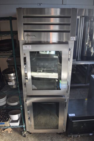 2014 True STG1HPT-2HG-2HG Stainless Steel Commercial 2 Half Size Door Reach In Pass Through Cooler Merchandiser on Commercial Casters. 115 Volts, 1 Phase. 27.5x36.5x84. Cannot Test Due To Plug Style