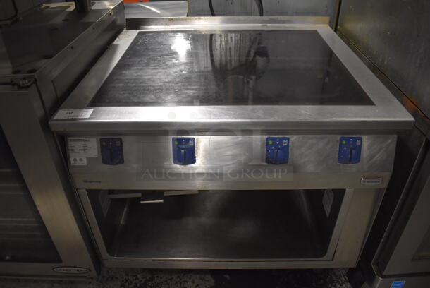 2013 Electrolux 584132 Stainless Steel Commercial Floor Style Electric Powered 4 Burner Range w/ Under Shelf. 208 Volts, 3 Phase. 40x36x38