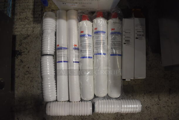 ALL ONE MONEY! Lot of 3M Water Filter Cartridges, 2 3M M Prefilter Cartridges, 2 3M CFS110-C20 Sediment Reduction Filter Cartridges and 4 Cuno CFS4201MF Scale Inhibitor and Particulate Reduction Cartridges in Clear Poly Bin