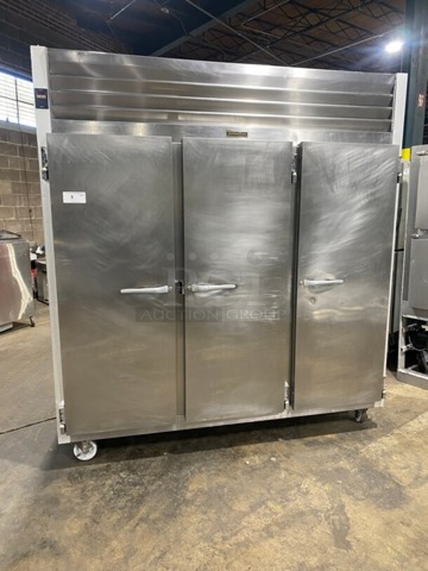 COOL! Traulsen Commercial 3 Door Reach In Freezer! With Poly Coated Racks! All Stainless Steel! On Casters! Model: G31310 SN: T15127L15 208/230V