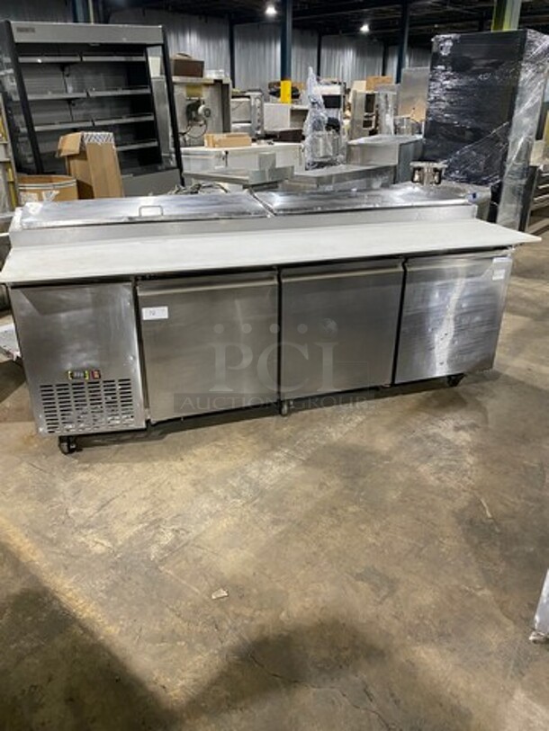 Commercial Refrigerated Pizza Prep Table! With Commercial Cutting Board! With 3 Door Storage Space Underneath! Poly Coated Racks! All Stainless Steel! On Casters!