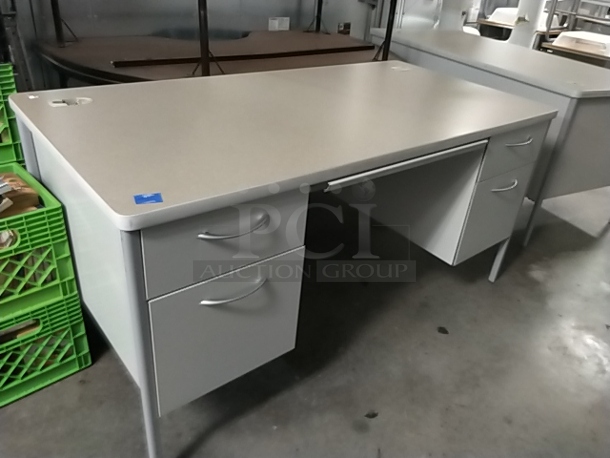 Gray Desk w/ 4 Drawers. 60x30x29.5 (Stickered blue tape #1)