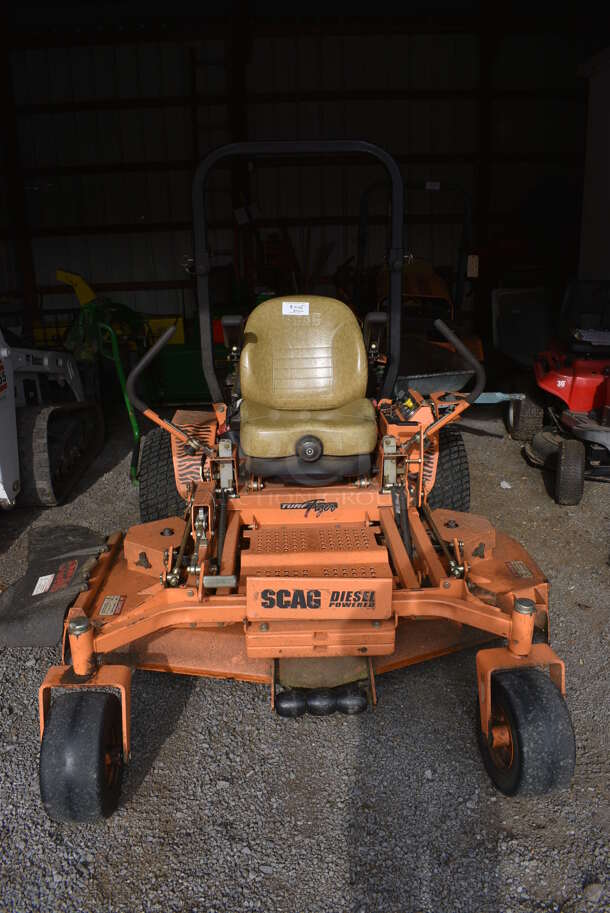 Scag STT61V-28CAT-SS Metal Commercial Diesel Powered Turf Tiger Riding Lawn Mower. Hours Read 849. BUYER MUST REMOVE. 80x90x70. Unit Was In Working Condition During The Last Mowing Season. (HS: Garage 1)