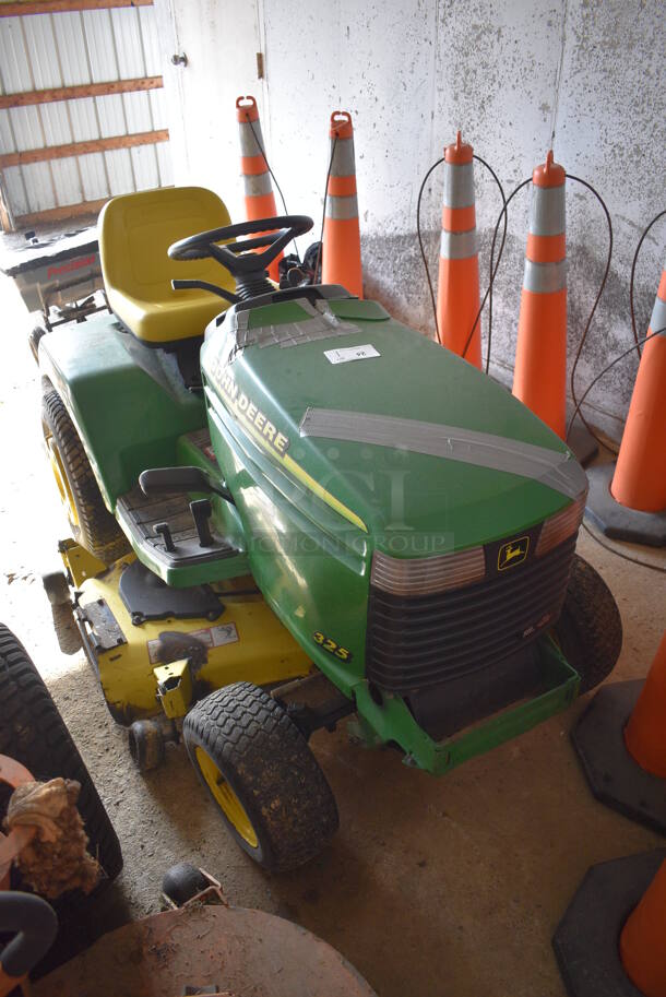 John Deere M00325C095264 325 Metal Commercial 18 HP V Twin Riding Lawn Mower. Comes w/ Key. Hours Read 954. BUYER MUST REMOVE. 52x68x41. (HS: Garage 2)