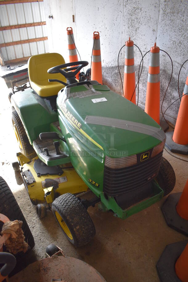 John Deere M00325C095264 325 Metal Commercial 18 HP V Twin Riding Lawn Mower. Comes w/ Key. Hours Read 954. BUYER MUST REMOVE. 52x68x41. (HS: Garage 2) - Image 1 of 12