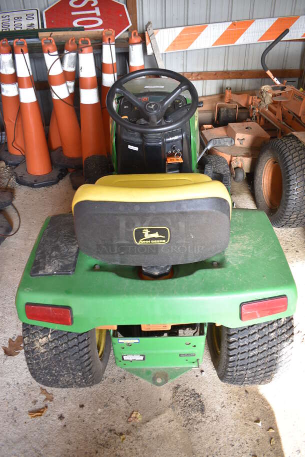 John Deere M00325C095264 325 Metal Commercial 18 HP V Twin Riding Lawn Mower. Comes w/ Key. Hours Read 954. BUYER MUST REMOVE. 52x68x41. (HS: Garage 2) - Image 6 of 12