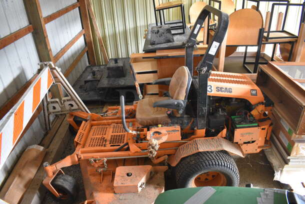 Scag STT-28CAT-SS Metal Commercial Turf Tiger Riding Lawn Mower. Hours Read 1549. BUYER MUST REMOVE. 72x95x68. Unit Is Hard To Start and Shuts Off While Mowing. (HS: Garage 2) - Image 3 of 12