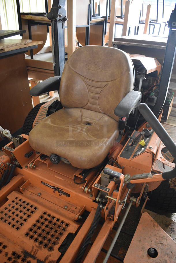 Scag STT-28CAT-SS Metal Commercial Turf Tiger Riding Lawn Mower. Hours Read 1549. BUYER MUST REMOVE. 72x95x68. Unit Is Hard To Start and Shuts Off While Mowing. (HS: Garage 2) - Image 5 of 12