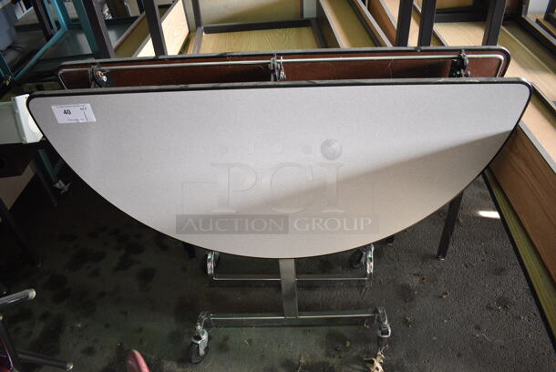 Gray Folding Portable Round Table on Commercial Casters. 47x18x40. (HS: Garage 4) - Image 1 of 4