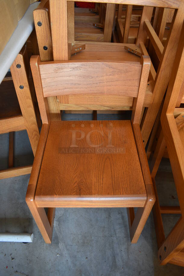 33 Various Wooden Library Chairs. Includes 19x18x32.  BUYER MUST REMOVE. 33 Times Your Bid! (HS: Garage 6)