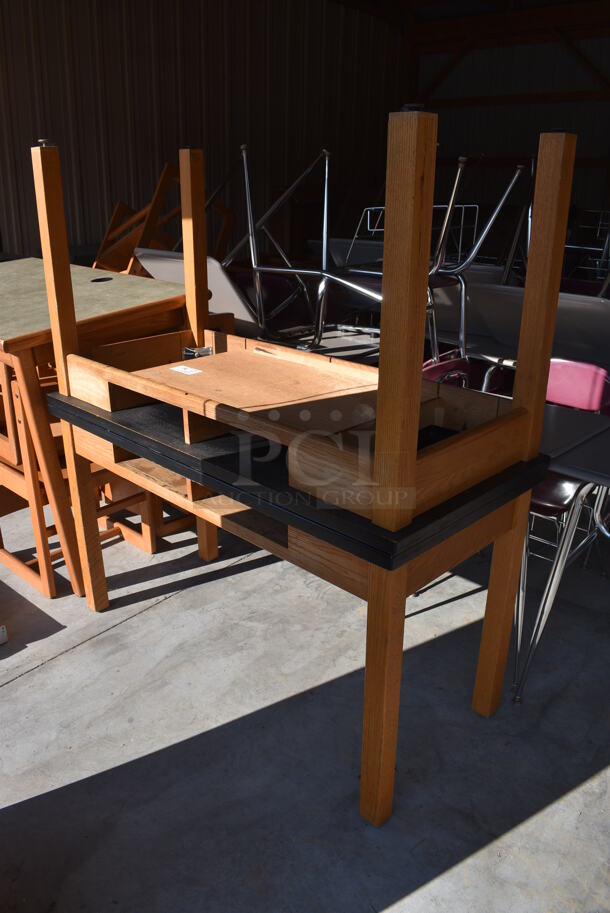 2 Wooden Tables w/ Black Countertop. 54x24x30. 2 Times Your Bid! (HS: Garage 6)