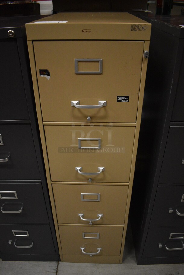 Tan Metal 4 Drawer Filing Cabinet. 15x26.5x52.5. (HS: Backroom)