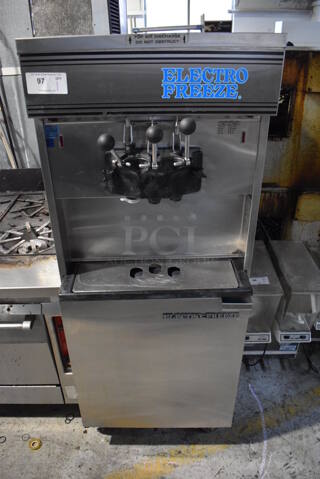 Electro Freeze 30TA-GAB-SS Stainless Steel Commercial Floor Style 2 Flavor w/ Twist Soft Serve Ice Cream Machine on Commercial Casters. 208/230 Volts, 1 Phase. 26x38x68