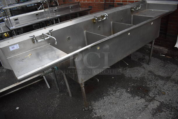 Stainless Steel Commercial 3 Bay Sink w/ Dual Drain Boards, 2 Faucets and 3 Handle Sets. 120x28x45. Bays 24x24x14. Drain Boards 22x24x1