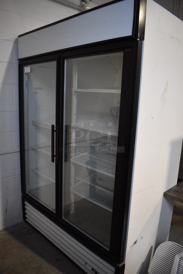 True GDM-49 Metal Commercial 2 Door Reach In Cooler Merchandiser w/ Poly Coated Racks. 115 Volts, 1 Phase. 54x30x79. Tested and Powers On But Does Not Get Cold