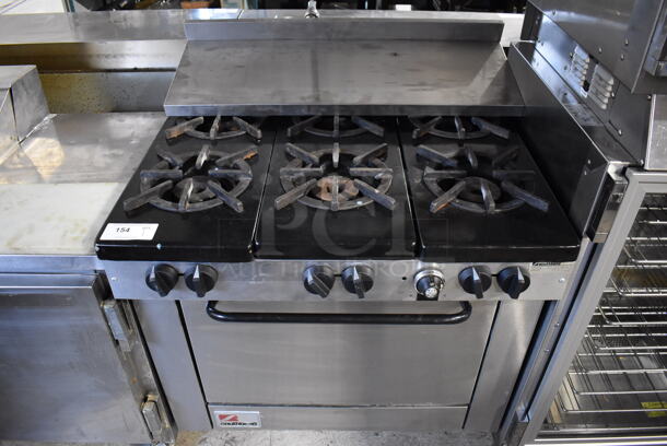 Southbend Stainless Steel Commercial Natural Gas Powered 6 Burner Range w/ Oven and Over Shelf. 37x31x37