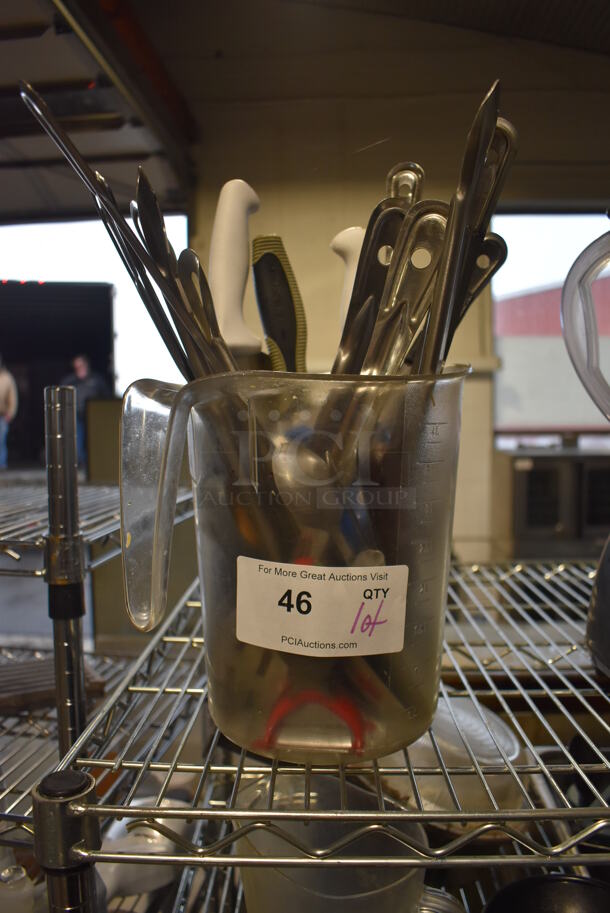ALL ONE MONEY! Lot of Various Utensils in Clear Poly Pitcher - Image 1 of 3