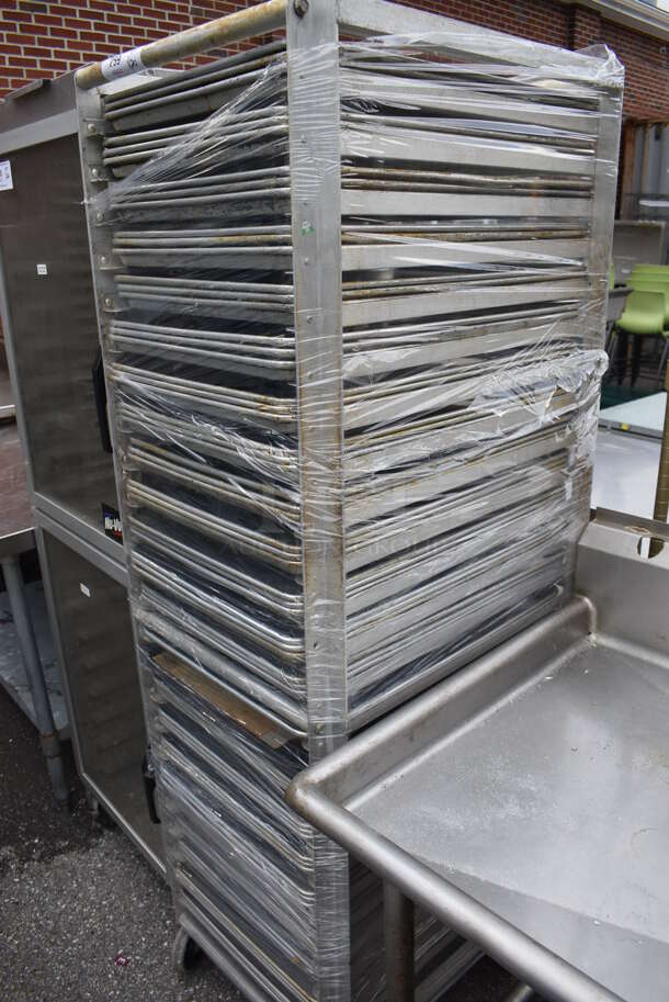 Metal Commercial Pan Transport Rack w/ 69 Metal Full Size Baking Pans on Commercial Casters. 21.5x27.5x69.5