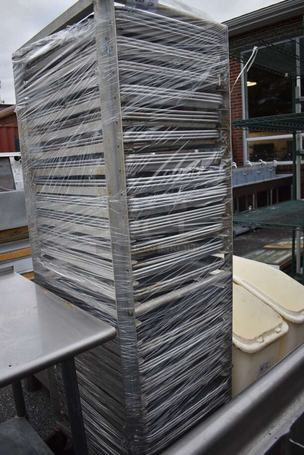 Metal Commercial Pan Transport Rack w/ 71 Metal Full Size Baking Pans on Commercial Casters. 21.5x27.5x69.5