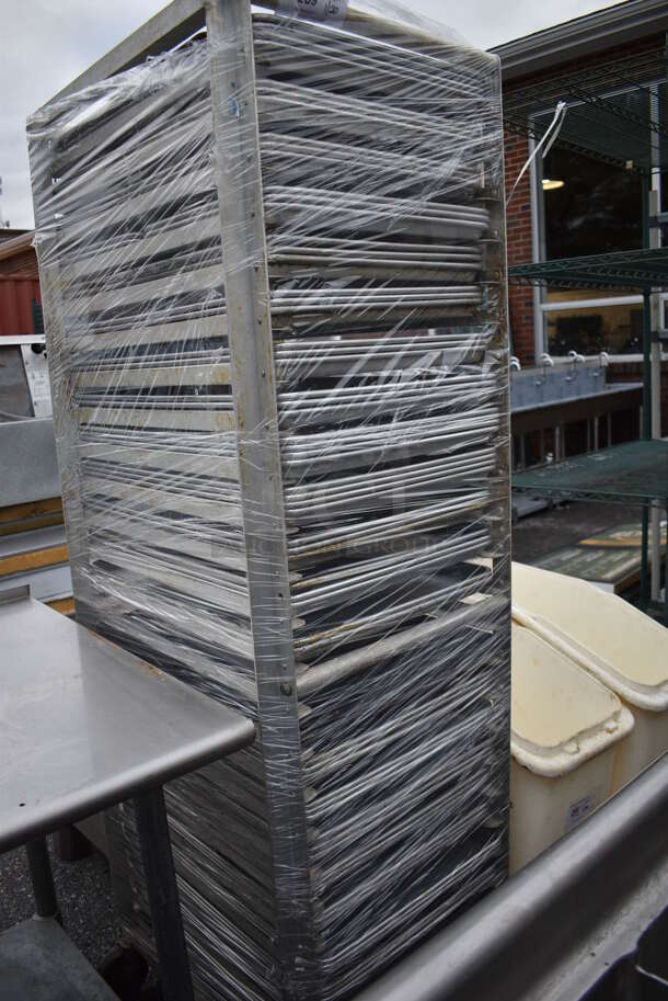 Metal Commercial Pan Transport Rack w/ 71 Metal Full Size Baking Pans on Commercial Casters. 21.5x27.5x69.5 - Image 1 of 3