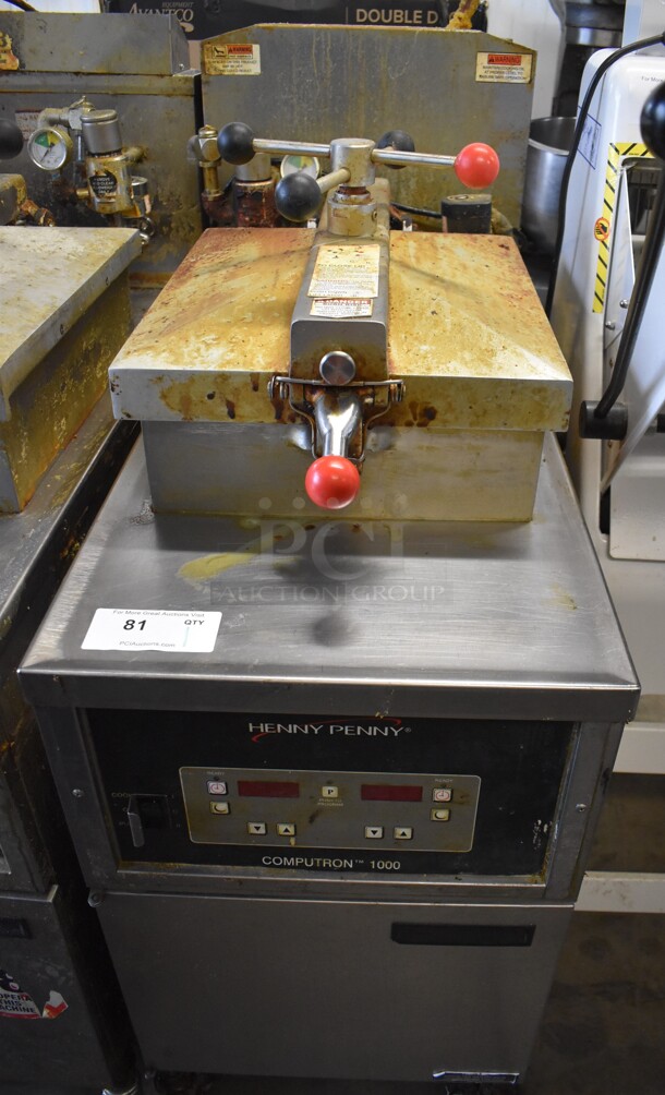 Henny Penny 600 Stainless Steel Commercial Floor Style Natural Gas Powered Pressure Fryer on Commercial Casters. 80,000 BTU. 18x39x49