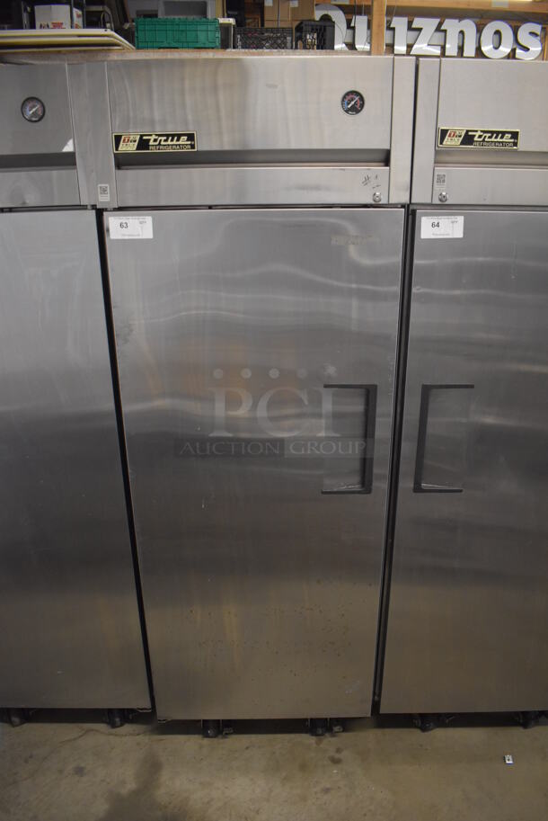 2011 True TG1R-1S Stainless Steel Commercial Single Door Reach In Cooler w/ Poly Coated Racks on Commercial Casters. 115 Volts, 1 Phase. 29x35x83. Tested and Working!