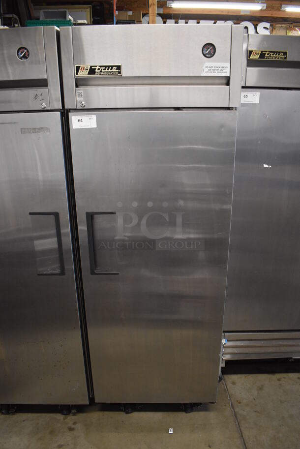 2011 True TG1R-1S Stainless Steel Commercial Single Door Reach In Cooler w/ Poly Coated Racks on Commercial Casters. 115 Volts, 1 Phase. 29x35x83. Tested and Working!