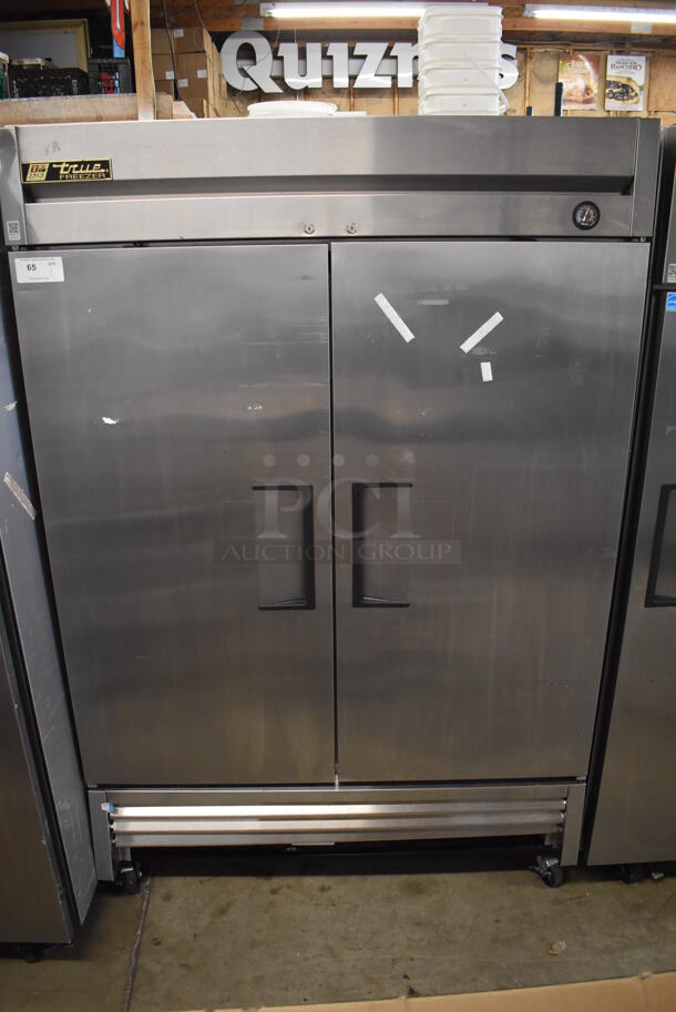 2015 True T-49F Stainless Steel Commercial Double Door Reach In Freezer w/ Poly Coated Racks on Commercial Casters. 115 Volts, 1 Phase. 54x32x83. Tested and Working!