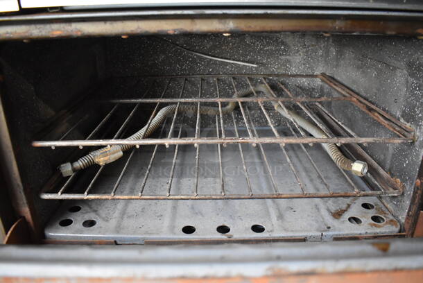 Garland Metal Commercial Natural Gas Powered 4 Burner Range w/ Flat Top Griddle, 2 Ovens, Over Shelf and Back Splash. 64x32x60 - Image 8 of 9