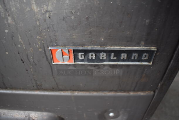 Garland Metal Commercial Natural Gas Powered 4 Burner Range w/ Flat Top Griddle, 2 Ovens, Over Shelf and Back Splash. 64x32x60 - Image 9 of 9