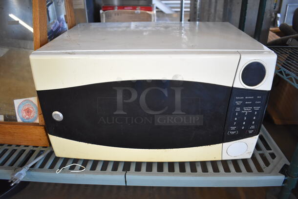 ALL ONE MONEY! Metro Lot of Various Items Including Framed Pictures, Utensils, Display Case, General Electric Microwave Oven. Does Not Include Shelving Unit - Image 7 of 11
