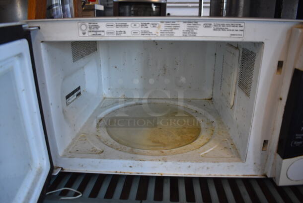 ALL ONE MONEY! Metro Lot of Various Items Including Framed Pictures, Utensils, Display Case, General Electric Microwave Oven. Does Not Include Shelving Unit - Image 10 of 11