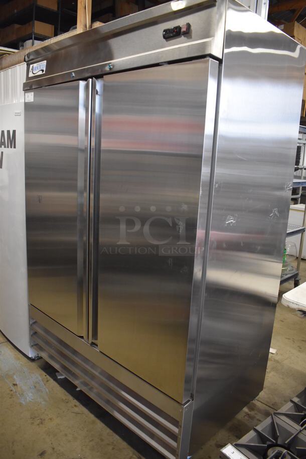 BRAND NEW SCRATCH AND DENT! Avantco 178SS2FHC Stainless Steel Commercial 2 Door Reach In Freezer w/ Poly Coated Racks on Commercial Casters. 115 Volts, 1 Phase. 54x34x82. Tested and Working!