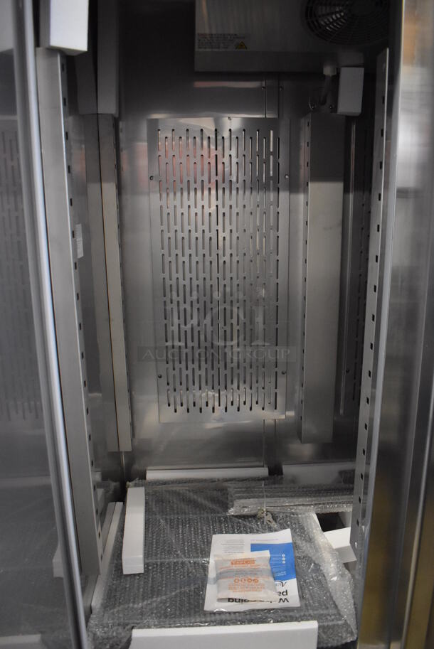 BRAND NEW SCRATCH AND DENT! Avantco 178SS2FHC Stainless Steel Commercial 2 Door Reach In Freezer w/ Poly Coated Racks on Commercial Casters. 115 Volts, 1 Phase. 54x34x82. Tested and Working! - Image 5 of 11