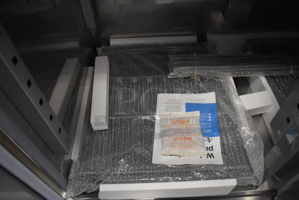 BRAND NEW SCRATCH AND DENT! Avantco 178SS2FHC Stainless Steel Commercial 2 Door Reach In Freezer w/ Poly Coated Racks on Commercial Casters. 115 Volts, 1 Phase. 54x34x82. Tested and Working! - Image 6 of 11