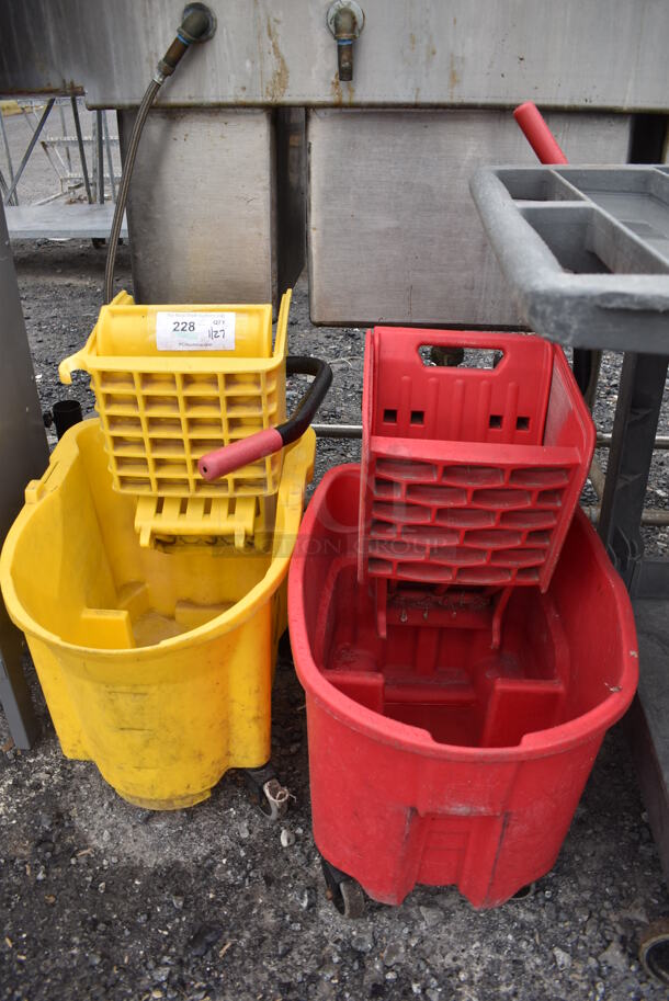 2 Poly Mop Buckets w/ Wringing Attachments on Casters. 15x25x25. 2 Times Your Bid!