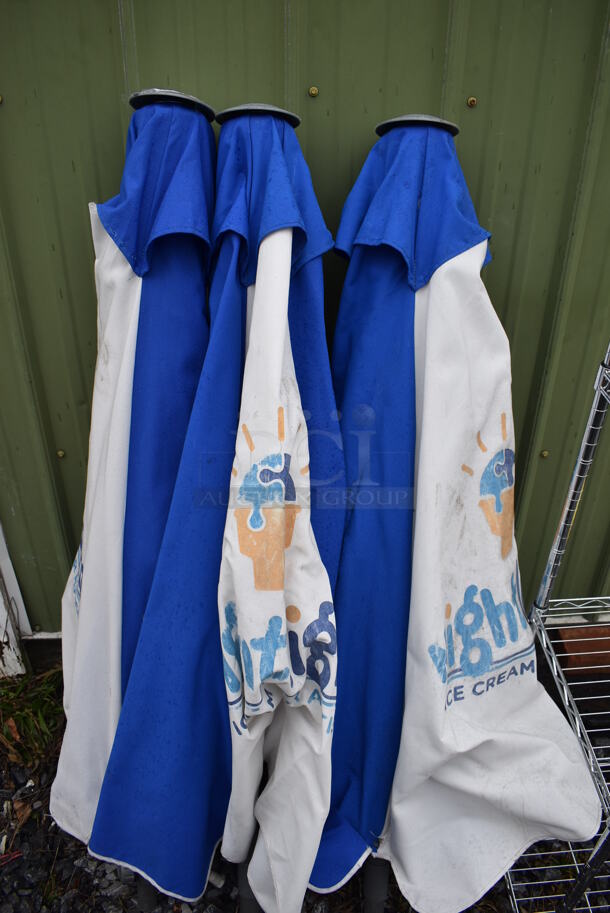 3 Blue and White Patio Umbrellas. 54