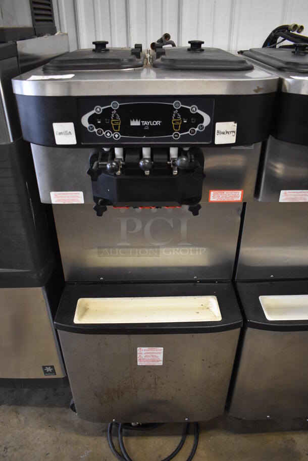 Taylor C713-33 Stainless Steel Commercial Water Cooled Floor Style 2 Flavor w/ Twist Soft Serve Ice Cream Machine on Commercial Casters. 208-230 Volts, 3 Phase. 26x37x60