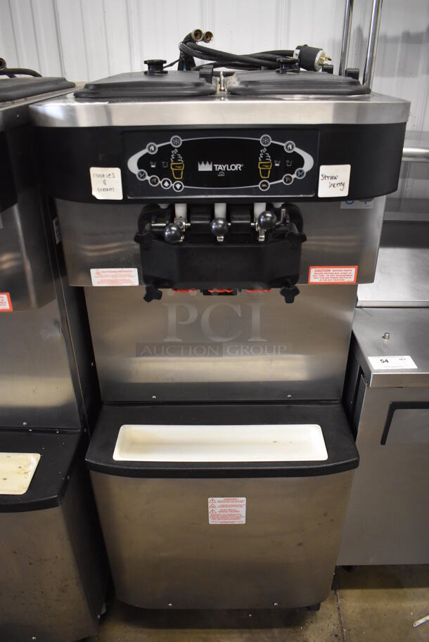 Taylor C713-33 Stainless Steel Commercial Water Cooled Floor Style 2 Flavor w/ Twist Soft Serve Ice Cream Machine on Commercial Casters. 208-230 Volts, 3 Phase. 26x37x60