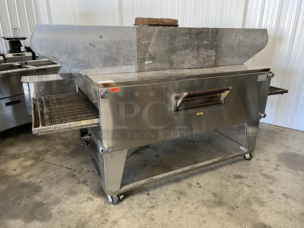 XLT 3270 Stainless Steel Commercial Natural Gas Powered Conveyor Pizza Oven on Commercial Casters. Comes w/ Hood / Vent. 180,000 BTU. 113x53x43, 99x37x22