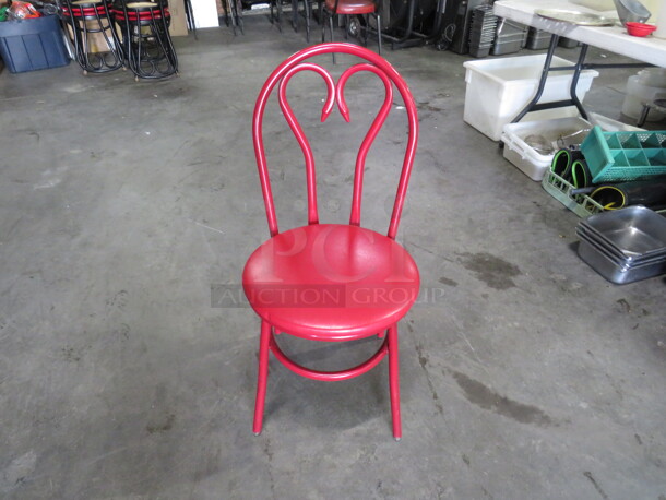 Red Metal Chair With Red Cushioned Seat. 4XBID.