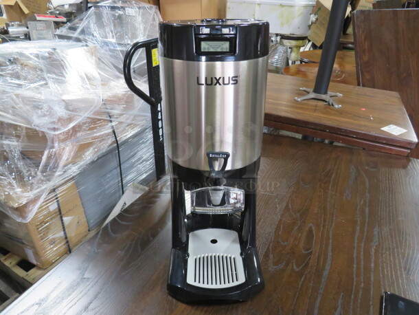 One Fetco 1.5 Gallon Coffee Dispenser With Stand. Model# L3D-15. $324.49
