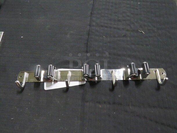 One Wall Mount Mop/Broom Holder. - Image 1 of 1